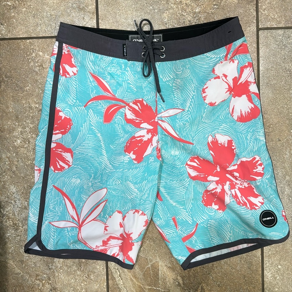 O’Neill size 27 board shorts, total length 16”